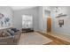 Inviting living room boasting high ceilings, a cozy sofa, and large windows for an airy and bright feel at 3411 S Vine St, Chandler, AZ 85248