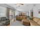 Open concept living space with hardwood floors, patio access and view into kitchen at 3411 S Vine St, Chandler, AZ 85248