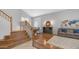 Spacious living room with hardwood floors, fireplace, and a stylish world map wall decoration at 3411 S Vine St, Chandler, AZ 85248
