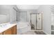 Bright main bathroom features a soaking tub and a glass enclosed shower at 3411 S Vine St, Chandler, AZ 85248