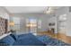 Comfortable primary bedroom with a slider to a private balcony and ample sunlight at 3411 S Vine St, Chandler, AZ 85248