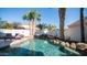 Lush backyard with a stunning custom pool, rock accents, and tropical landscaping, creating a serene retreat at 3411 S Vine St, Chandler, AZ 85248