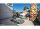 Backyard retreat features a relaxing pool and hot tub with mature palms, creating a serene and private oasis at 3411 S Vine St, Chandler, AZ 85248