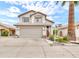 Charming two-story home featuring desert landscaping, two car garage, and neutral color palette at 3912 E Rockwood Dr, Phoenix, AZ 85050