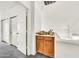 Hallway featuring closet, built in storage and neutral carpet at 3912 E Rockwood Dr, Phoenix, AZ 85050