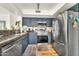 Well-equipped kitchen featuring stainless steel appliances, granite countertops, and ample cabinet space at 3912 E Rockwood Dr, Phoenix, AZ 85050