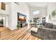 Spacious living room with vaulted ceilings, wood floors, contemporary decor, and backyard views at 3912 E Rockwood Dr, Phoenix, AZ 85050