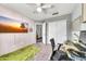 This office space features a large monitor, a desk, and a neutral colored carpet at 3912 E Rockwood Dr, Phoenix, AZ 85050
