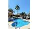 Sparkling private pool surrounded by lush palms and tropical seating areas, perfect for relaxing at 3912 E Rockwood Dr, Phoenix, AZ 85050