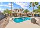 Inviting backyard pool with lush tropical landscaping, creating a serene and private outdoor retreat at 3912 E Rockwood Dr, Phoenix, AZ 85050