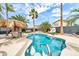 Stunning backyard pool and lounge area, surrounded by lush palm trees, perfect for relaxing and entertaining guests at 3912 E Rockwood Dr, Phoenix, AZ 85050