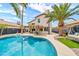 Gorgeous backyard pool, surrounded by palm trees, offering a perfect oasis for relaxation and entertainment at 3912 E Rockwood Dr, Phoenix, AZ 85050