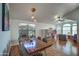 Open-concept dining area features hardwood floors, pendant lighting, and a bright window at 4350 E Abraham Ln, Phoenix, AZ 85050