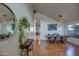 Bright dining room with hardwood floors, modern light fixtures, and large windows at 4350 E Abraham Ln, Phoenix, AZ 85050