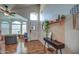 Inviting entryway features stylish decor, wood flooring, and natural light at 4350 E Abraham Ln, Phoenix, AZ 85050