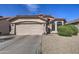Charming single-story home featuring a two-car garage and low-maintenance desert landscaping at 4350 E Abraham Ln, Phoenix, AZ 85050
