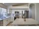 Modern kitchen features white cabinets, stainless steel appliances, and quartz countertops at 4350 E Abraham Ln, Phoenix, AZ 85050