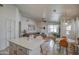 Bright open living area featuring neutral decor, wood floors, and a dining space at 4350 E Abraham Ln, Phoenix, AZ 85050