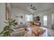 Well-lit living room featuring wood floors, comfortable seating, and ample natural light streaming through the window at 4350 E Abraham Ln, Phoenix, AZ 85050