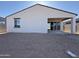 Back exterior of home with covered patio and window at 4439 S 95Th Dr, Tolleson, AZ 85353