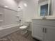 Bathroom featuring a shower-tub, sleek vanity, and modern fixtures at 4439 S 95Th Dr, Tolleson, AZ 85353