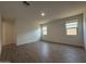 Spacious bedroom featuring three bright windows and wood-look tile flooring at 4439 S 95Th Dr, Tolleson, AZ 85353
