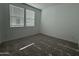 Cozy bedroom featuring neutral carpet, white walls and window with natural light at 4439 S 95Th Dr, Tolleson, AZ 85353