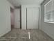Bedroom with plush carpet, white walls, closet and door leading to other parts of house at 4439 S 95Th Dr, Tolleson, AZ 85353