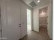 Bright foyer with wood-look flooring, white trim, and views into the home at 4439 S 95Th Dr, Tolleson, AZ 85353