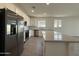 Modern kitchen featuring stainless steel appliances and a spacious center island with quartz countertop at 4439 S 95Th Dr, Tolleson, AZ 85353