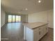 A bright open-concept living area with tile flooring and sliding glass doors to the backyard at 4439 S 95Th Dr, Tolleson, AZ 85353
