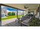 Spacious covered back patio with outdoor seating, ceiling fans, and a view of the grassy backyard at 4839 W Juniper Ave, Glendale, AZ 85306