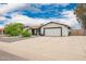 Charming single-story home featuring a spacious driveway and a two-car garage at 4839 W Juniper Ave, Glendale, AZ 85306
