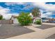 Neutral home with desert landscaping, two-car garage, and inviting facade at 4839 W Juniper Ave, Glendale, AZ 85306