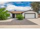Charming single-story home with neutral stucco, a well-manicured front yard, and a two-car garage at 4839 W Juniper Ave, Glendale, AZ 85306