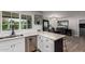 Bright kitchen with white countertops and cabinets, overlooking the dining area at 4839 W Juniper Ave, Glendale, AZ 85306
