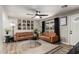 Inviting living room with neutral walls, wood-look floors, and modern decor for a cozy gathering space at 4839 W Juniper Ave, Glendale, AZ 85306