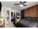 Bedroom with modern furnishings, including a dark bed frame and built in closet at 4839 W Juniper Ave, Glendale, AZ 85306