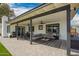 This beautiful patio boasts an outdoor lounge and a dining area at 4839 W Juniper Ave, Glendale, AZ 85306