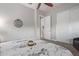 Bedroom with light gray walls, a sliding closet door, and a ceiling fan at 4876 N 207Th Ln, Buckeye, AZ 85396