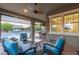 Relax on the covered patio and enjoy the views of the pool and backyard at 4876 N 207Th Ln, Buckeye, AZ 85396