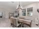 The dining room features an open layout with neutral decor, views to the living room, and ample light at 4876 N 207Th Ln, Buckeye, AZ 85396