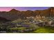 Luxury home set atop a picturesque hillside with mountains in the background at 4876 N 207Th Ln, Buckeye, AZ 85396