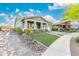 Welcoming single-Gathering home with well-maintained desert landscaping and a charming front porch at 4876 N 207Th Ln, Buckeye, AZ 85396