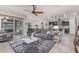Open-concept living room and kitchen with modern appliances and stylish furnishings at 4876 N 207Th Ln, Buckeye, AZ 85396