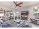 The stylish living room features modern decor, comfortable seating, and ample natural light at 4876 N 207Th Ln, Buckeye, AZ 85396