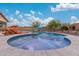 Lounge by the pool and enjoy the spa with water features in this lovely backyard at 4876 N 207Th Ln, Buckeye, AZ 85396