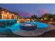 Relaxing backyard with a private pool, spa, outdoor bar and grilling area at 4876 N 207Th Ln, Buckeye, AZ 85396