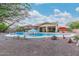 Wonderful backyard pool with a spa, fountains, and inviting lounge areas for ultimate outdoor enjoyment at 4876 N 207Th Ln, Buckeye, AZ 85396