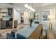 Inviting dining room showcasing a modern light fixture and a view into the bedroom at 5104 N 32Nd St # 105, Phoenix, AZ 85018